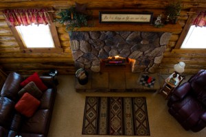 A fireplace in the middle of a living room.